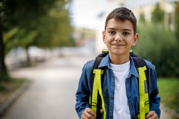smiling boy with backpack
